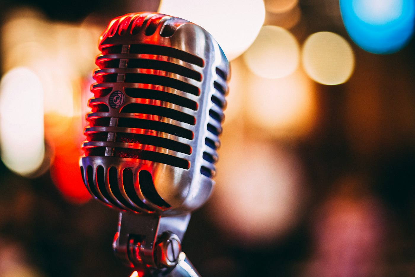 Stage microphone and soft lights — illustrative music stock