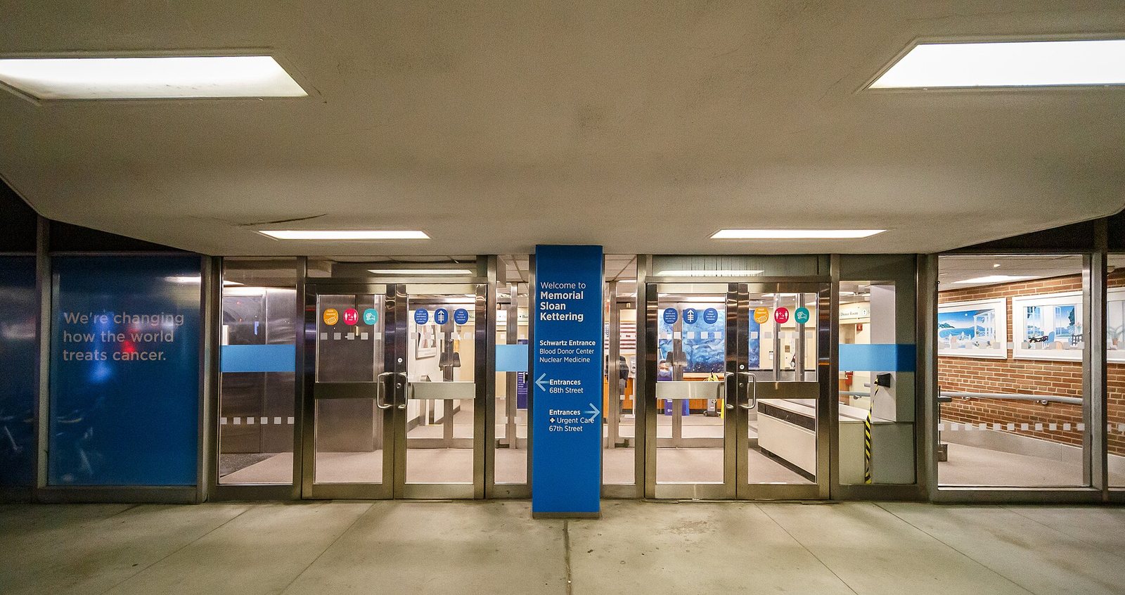 Entrance to Memorial Sloan Kettering's Schwartz Cancer Research Building on First Avenue in Manhattan, at night — illustrative
