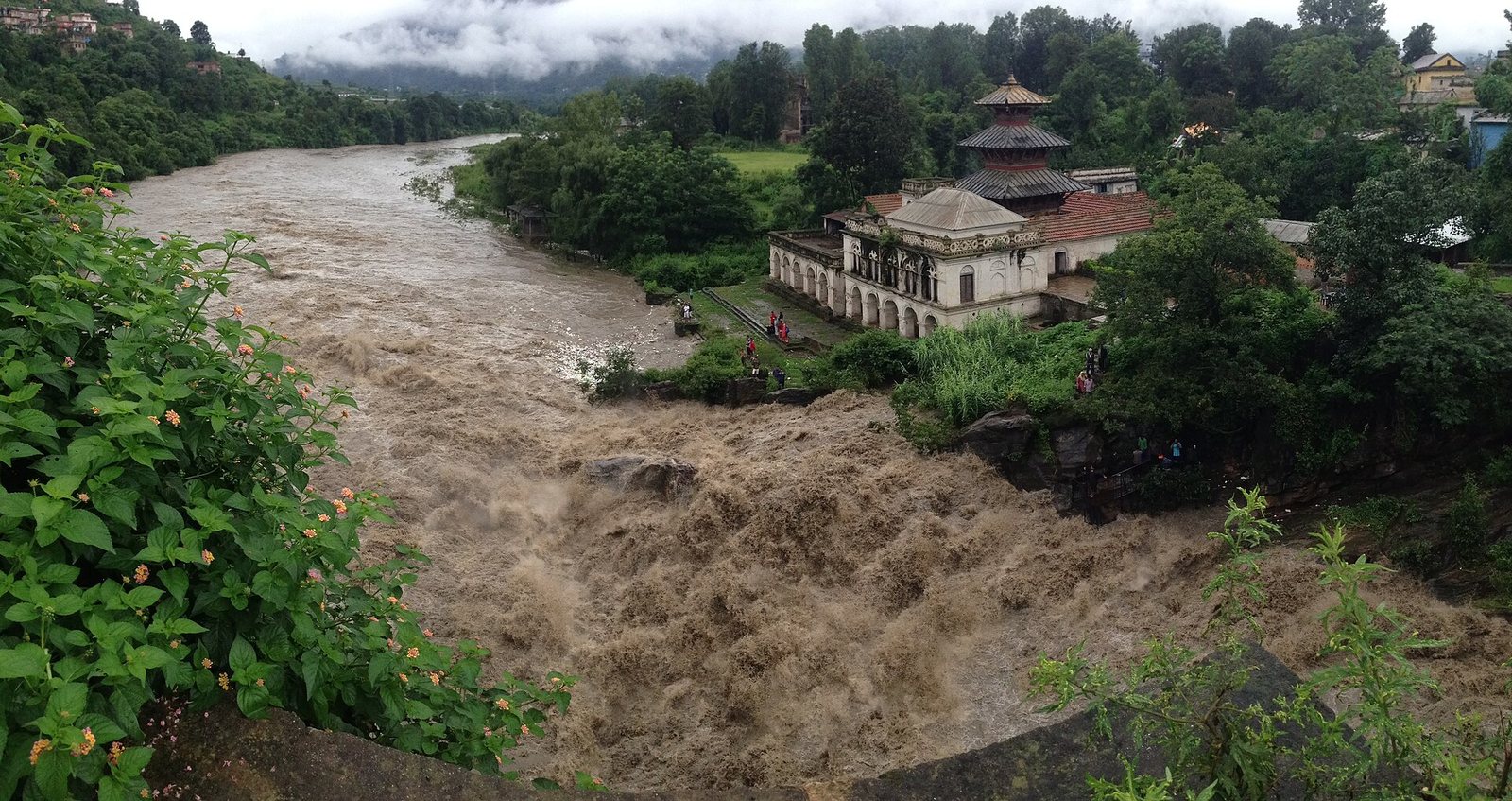 The Bagmati River in flood during the 2016 monsoon in Nepal — illustrative, not a photo of current conditions