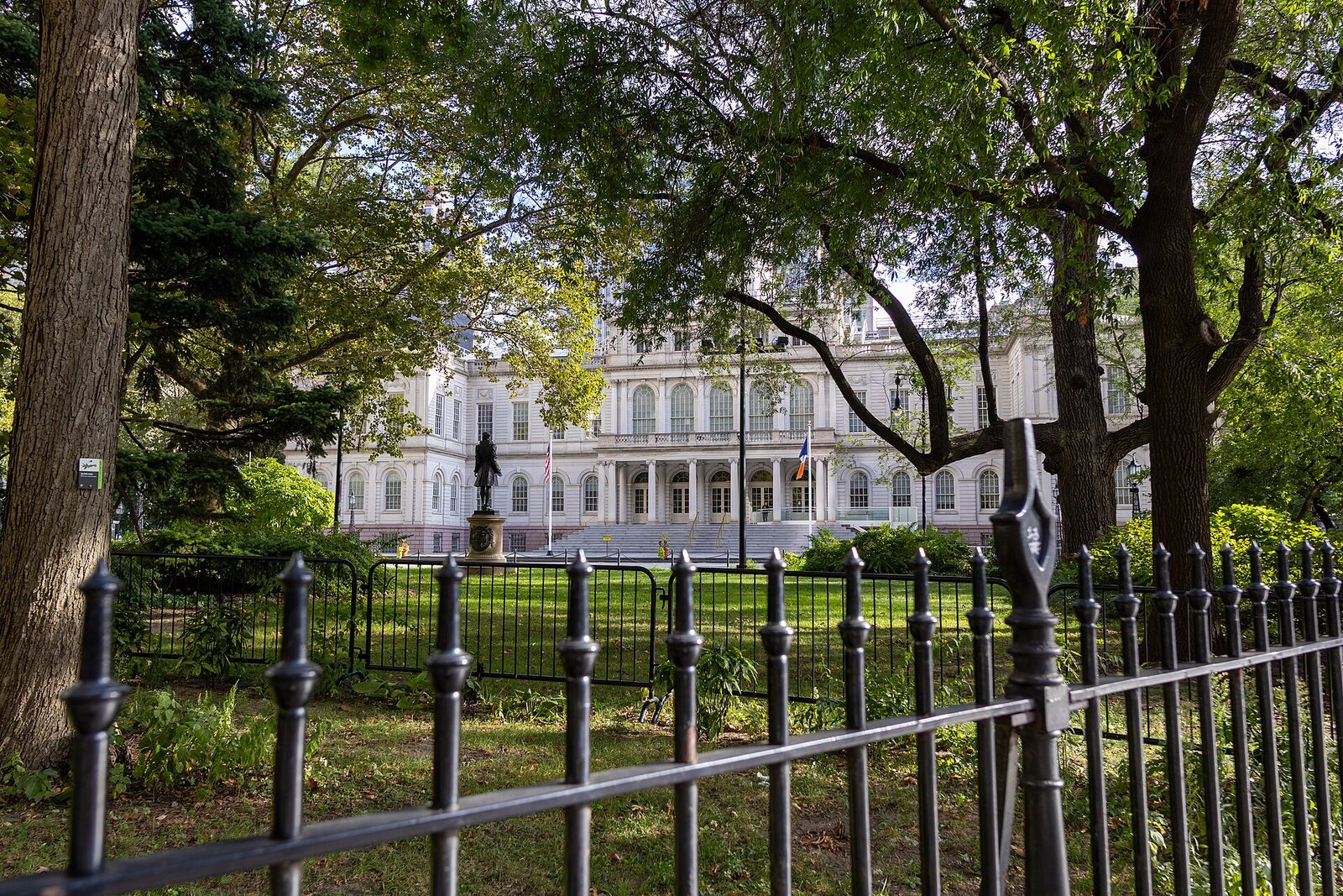 New York City Hall seen through the iron fence of City Hall Park