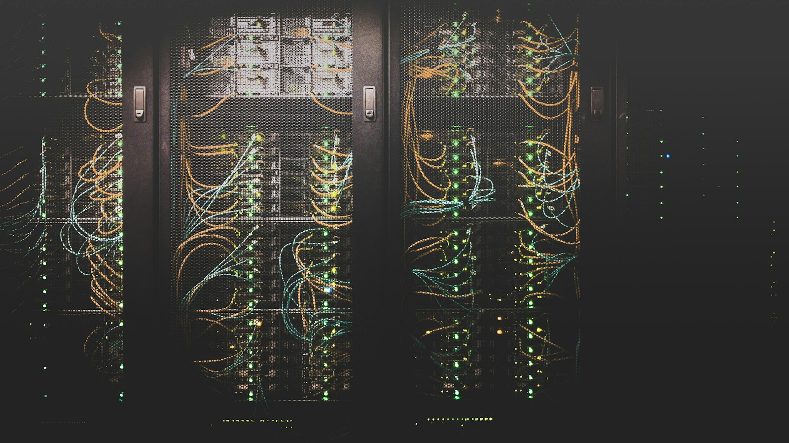 Illustrative image of server racks with bundled network cables inside a data center